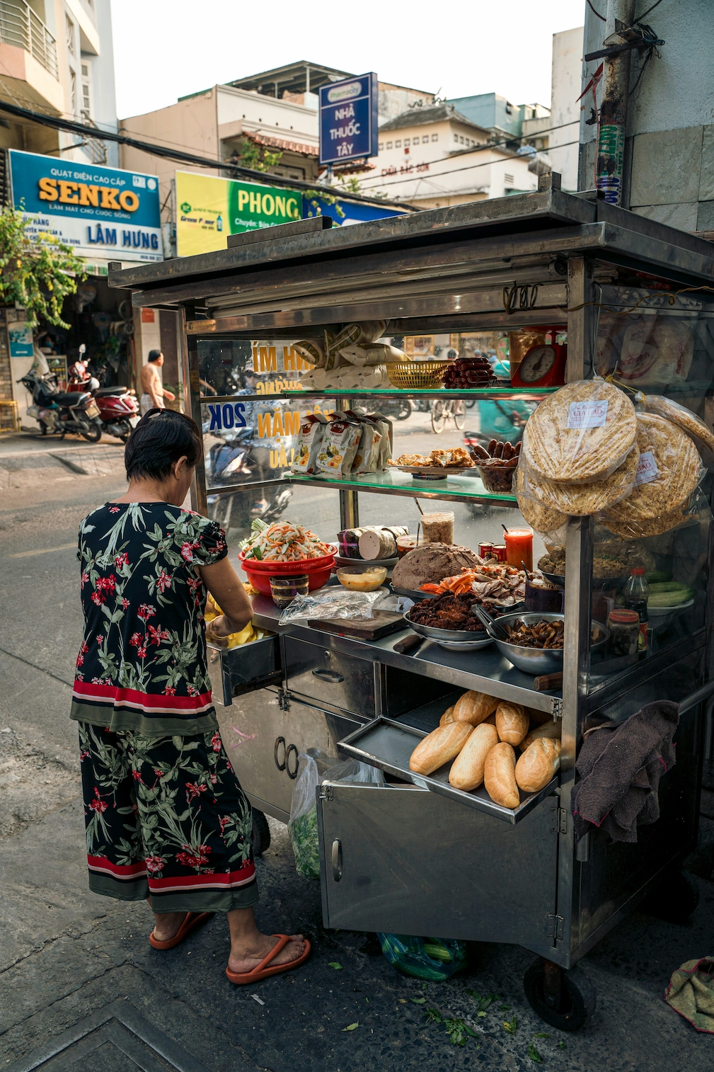 Saigon bánh mì cart with baguettes and fillings on display