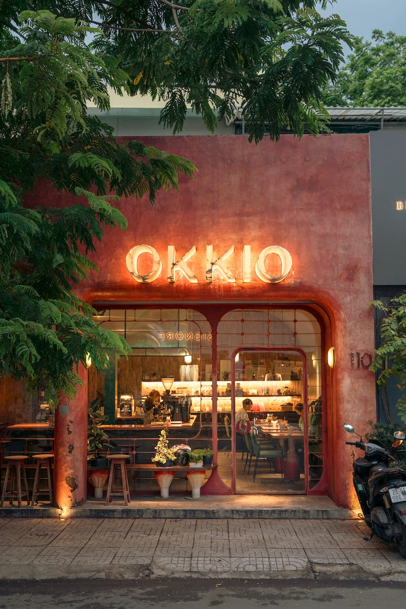 Okkio Caffe storefront at dusk